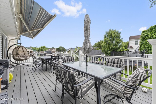 81 Lockwood Ave, Woodbridge, NJ 07095 - wooden terrace with outdoor dining space and a trampoline