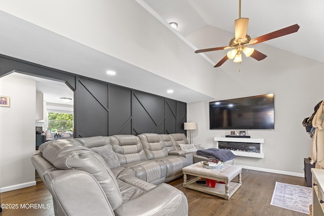 81 Lockwood Ave, Woodbridge, NJ 07095 - living area with dark wood-style floors, ceiling fan, arched walkways, and high vaulted ceiling