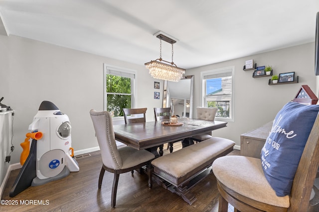 81 Lockwood Ave, Woodbridge, NJ 07095 - dining space with healthy amount of natural light and dark wood-type flooring