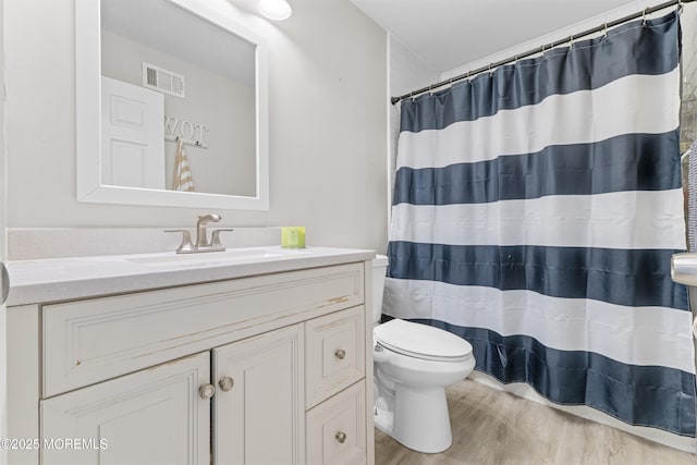 81 Lockwood Ave, Woodbridge, NJ 07095 - bathroom with vanity, wood finished floors, and a shower with shower curtain