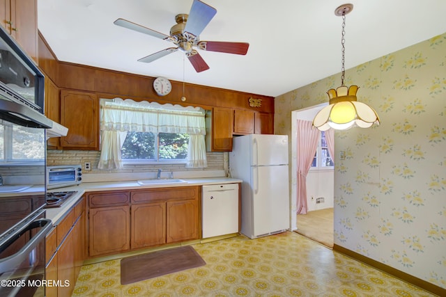 16 Burdge Dr, Howell, NJ 07731 - kitchen featuring white appliances, wallpapered walls, a ceiling fan, light countertops, and tasteful backsplash