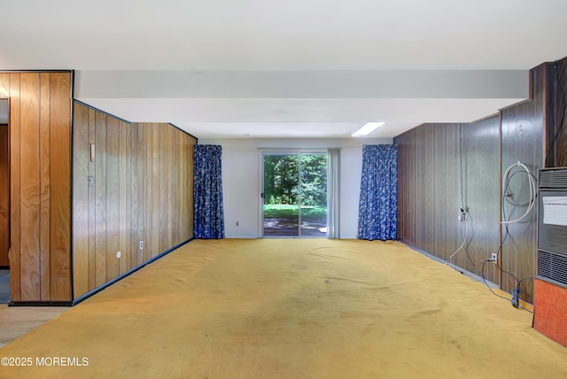 16 Burdge Dr, Howell, NJ 07731 - unfurnished living room featuring wood walls and light colored carpet