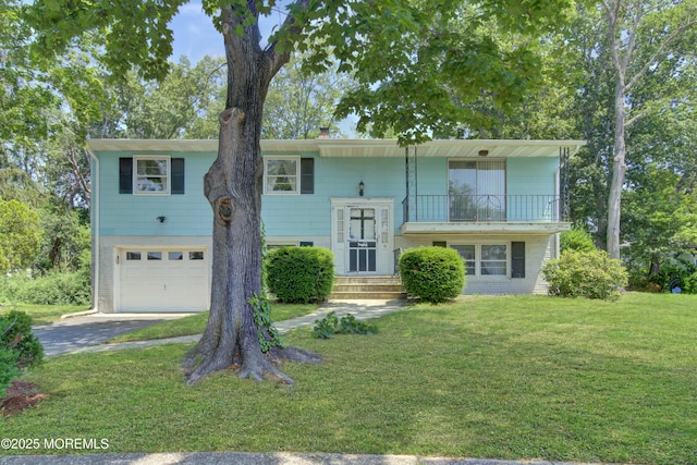 16 Burdge Dr, Howell, NJ 07731 - split foyer home featuring a balcony, an attached garage, a front lawn, and driveway
