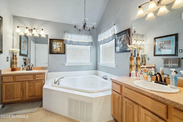 15 Savannah Dr, Barnegat, NJ 08005 - bathroom featuring a chandelier, two vanities, a tub with jets, tile patterned floors, and lofted ceiling