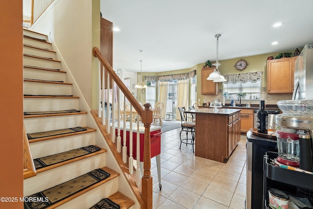 15 Savannah Dr, Barnegat, NJ 08005 - kitchen with a kitchen bar, dark countertops, recessed lighting, pendant lighting, and light tile patterned floors