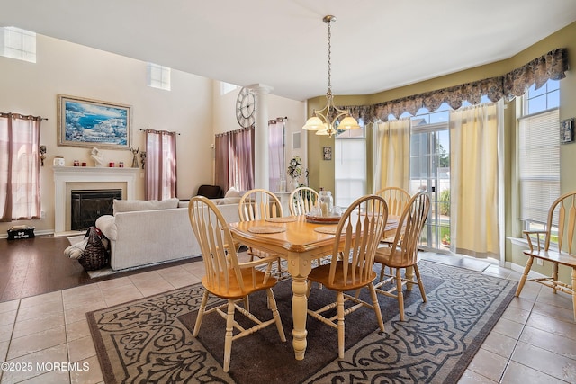 15 Savannah Dr, Barnegat, NJ 08005 - dining room featuring a chandelier, light tile patterned floors, and a glass covered fireplace
