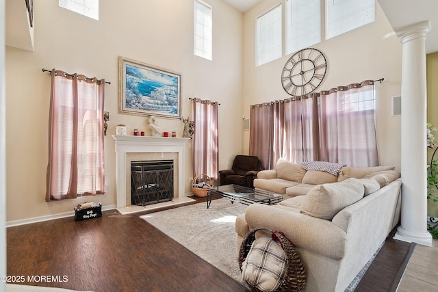 15 Savannah Dr, Barnegat, NJ 08005 - living area with decorative columns, a high ceiling, a high end fireplace, and wood finished floors