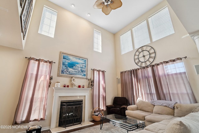 15 Savannah Dr, Barnegat, NJ 08005 - living area featuring a high ceiling, a ceiling fan, a fireplace, and plenty of natural light