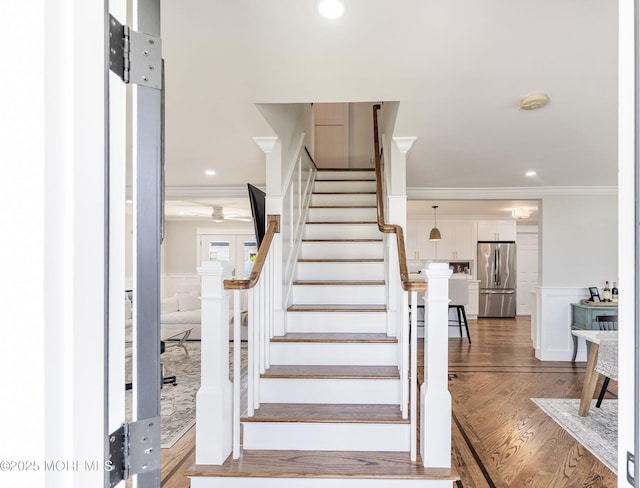 1810 Shore Blvd, Point Pleasant, NJ 08742 - staircase featuring ornamental molding, a wainscoted wall, wood finished floors, a decorative wall, and recessed lighting