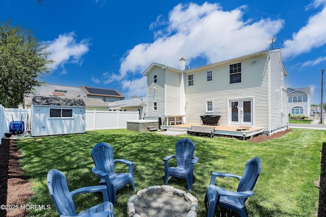 1810 Shore Blvd, Point Pleasant, NJ 08742 - back of house featuring french doors, a fenced backyard, a storage shed, a deck, and a chimney