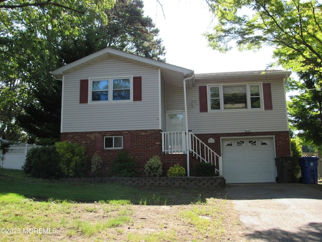 531 Princess Ct, Toms River, NJ 08753 - split foyer home featuring brick siding, driveway, and a garage