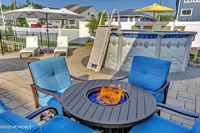 4 Longpoint Dr, Brick, NJ 08723 - fenced backyard with an outdoor pool, a patio area, a fire pit, and a residential view
