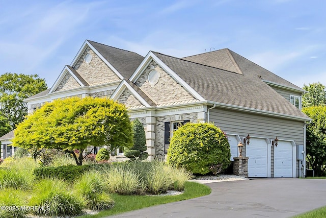 1 Ethan Dr, Farmingdale, NJ 07727 - view of side of property with stone siding, driveway, and a shingled roof