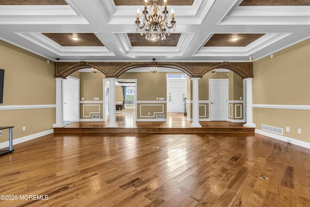 1 Ethan Dr, Farmingdale, NJ 07727 - unfurnished living room with decorative columns, a chandelier, hardwood / wood-style floors, coffered ceiling, and ornamental molding
