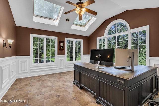 1 Ethan Dr, Farmingdale, NJ 07727 - home office featuring a skylight, a wainscoted wall, lofted ceiling, a ceiling fan, and a decorative wall