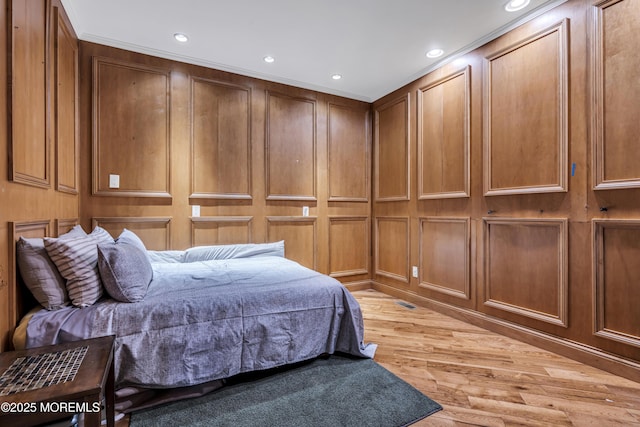 1 Ethan Dr, Farmingdale, NJ 07727 - bedroom featuring a decorative wall, light wood-style floors, and recessed lighting