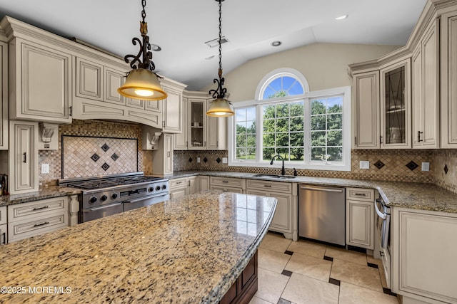 1 Ethan Dr, Farmingdale, NJ 07727 - kitchen with stainless steel appliances, cream cabinetry, glass insert cabinets, light stone countertops, and lofted ceiling