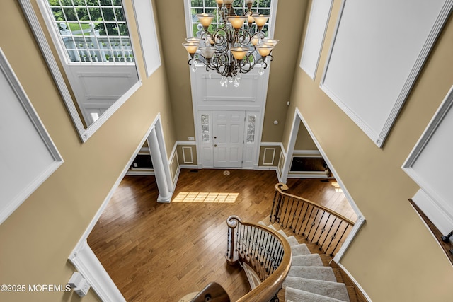 1 Ethan Dr, Farmingdale, NJ 07727 - entrance foyer with a high ceiling, stairs, hardwood / wood-style flooring, and a chandelier