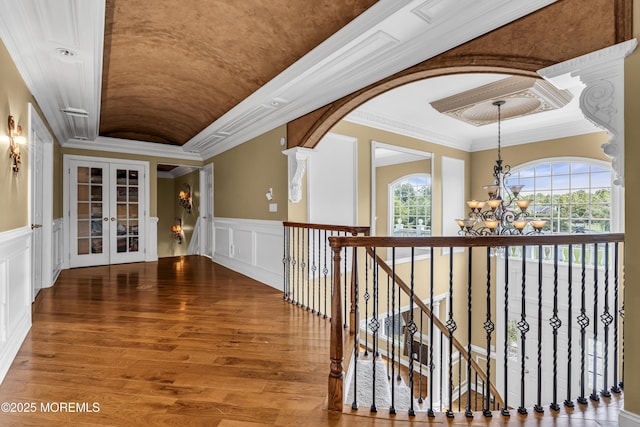1 Ethan Dr, Farmingdale, NJ 07727 - hall with a chandelier, a decorative wall, ornamental molding, french doors, and wood finished floors