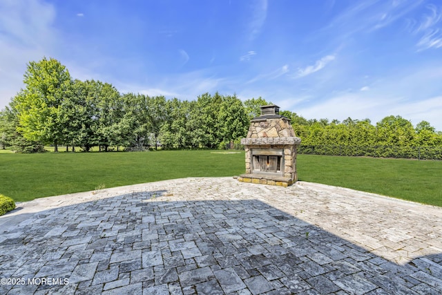1 Ethan Dr, Farmingdale, NJ 07727 - view of patio featuring an outdoor stone fireplace