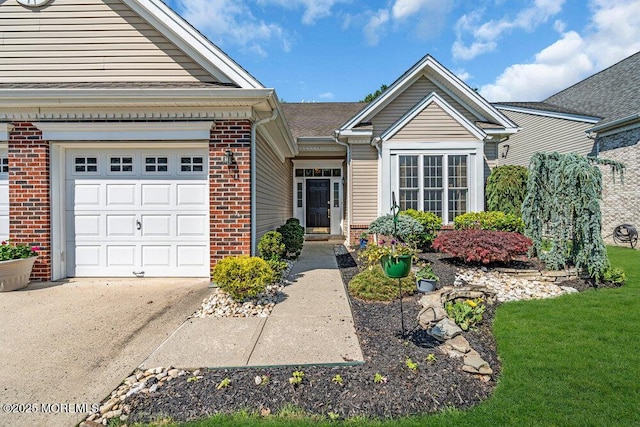 24 Oakmont Ln, Jackson, NJ 08527 - view of front facade with brick siding, an attached garage, and driveway