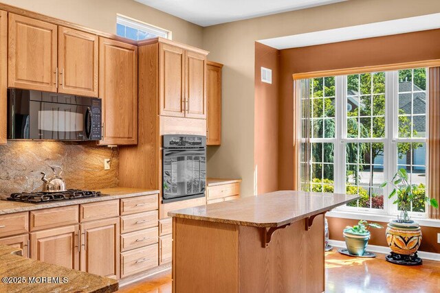24 Oakmont Ln, Jackson, NJ 08527 - kitchen featuring black appliances, healthy amount of natural light, and backsplash