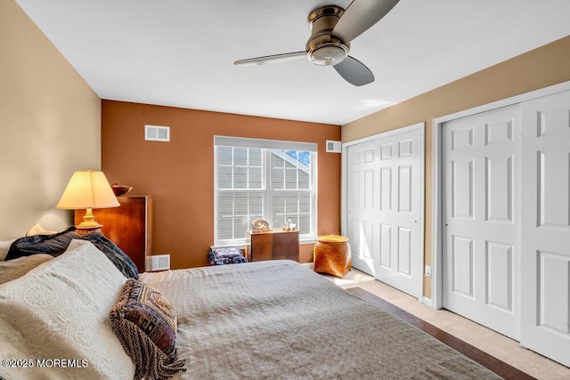 24 Oakmont Ln, Jackson, NJ 08527 - bedroom with two closets, ceiling fan, and carpet floors