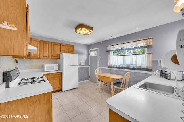 353 Cokes Dr, Toms River, NJ 08753 - kitchen featuring white appliances, light countertops, extractor fan, light tile patterned floors, and brown cabinets