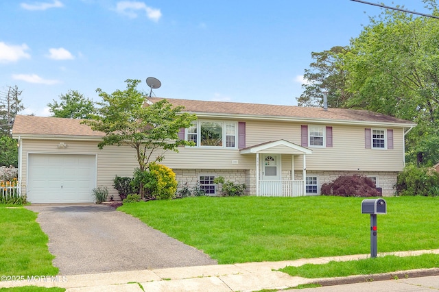 353 Cokes Dr, Toms River, NJ 08753 - bi-level home featuring an attached garage, a front yard, and asphalt driveway
