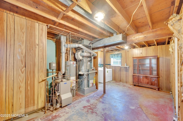 353 Cokes Dr, Toms River, NJ 08753 - below grade area featuring washing machine and clothes dryer, water heater, and wood walls