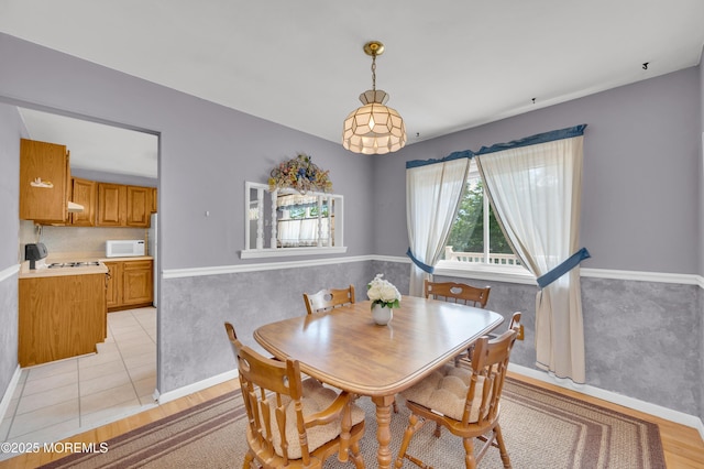 353 Cokes Dr, Toms River, NJ 08753 - dining room with light wood finished floors and wainscoting