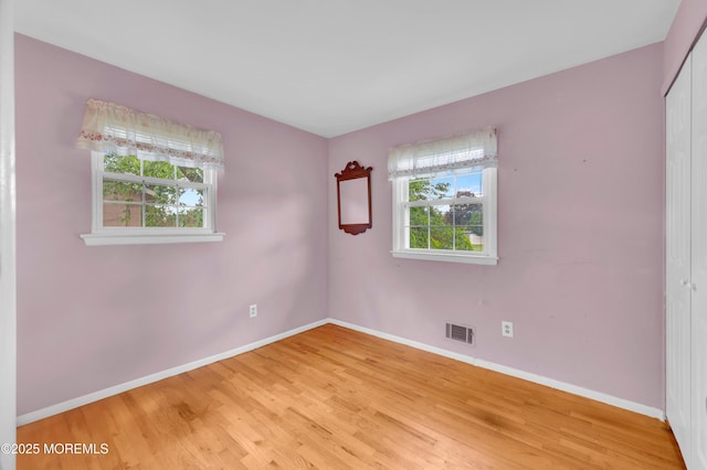 353 Cokes Dr, Toms River, NJ 08753 - spare room with plenty of natural light and light wood-style flooring