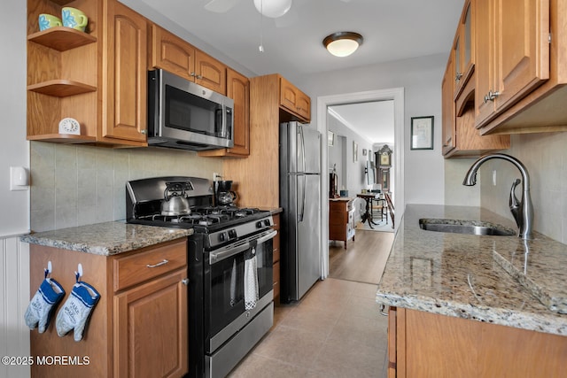 10 Ann Ct, Tinton Falls, NJ 07724 - kitchen featuring appliances with stainless steel finishes, light stone countertops, backsplash, open shelves, and ceiling fan