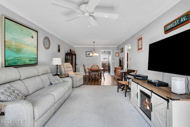 10 Ann Ct, Tinton Falls, NJ 07724 - living area featuring ornamental molding, a chandelier, light wood-type flooring, and a ceiling fan