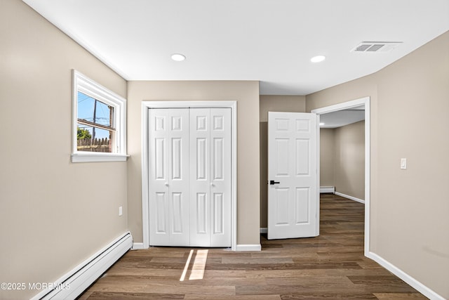179A Buckelew Ave Unit A, Jamesburg, NJ 08831 - unfurnished bedroom with a baseboard radiator, wood finished floors, a closet, and recessed lighting