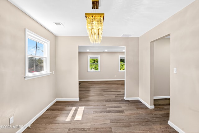 179A Buckelew Ave Unit A, Jamesburg, NJ 08831 - empty room with a chandelier, plenty of natural light, and wood finished floors