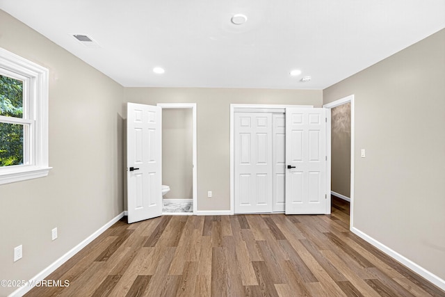 179A Buckelew Ave Unit A, Jamesburg, NJ 08831 - unfurnished bedroom featuring wood finished floors, a closet, ensuite bath, and recessed lighting