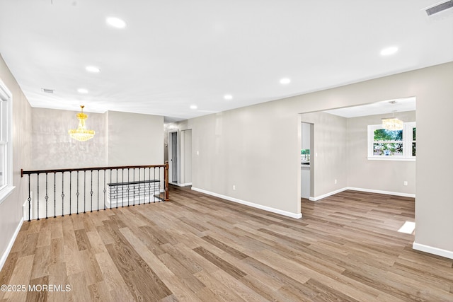 179A Buckelew Ave Unit A, Jamesburg, NJ 08831 - spare room featuring a chandelier, wood finished floors, and recessed lighting