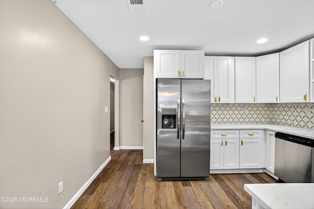 179A Buckelew Ave Unit A, Jamesburg, NJ 08831 - kitchen featuring appliances with stainless steel finishes, white cabinets, dark wood-type flooring, backsplash, and recessed lighting