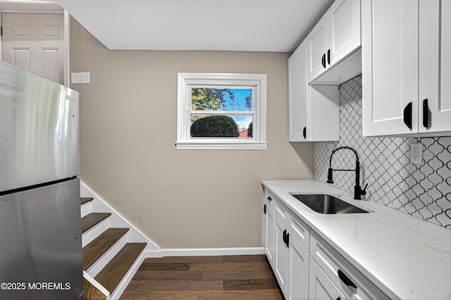 179A Buckelew Ave Unit A, Jamesburg, NJ 08831 - kitchen featuring freestanding refrigerator, tasteful backsplash, light stone counters, dark wood finished floors, and white cabinets
