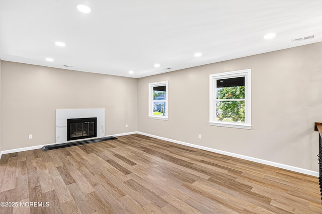 179A Buckelew Ave Unit A, Jamesburg, NJ 08831 - unfurnished living room featuring recessed lighting, light wood-style flooring, and a glass covered fireplace