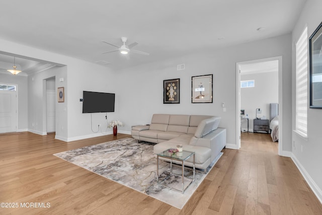 65 Ambermist Way, Forked River, NJ 08731 - living room with wood finished floors, ceiling fan, and healthy amount of natural light