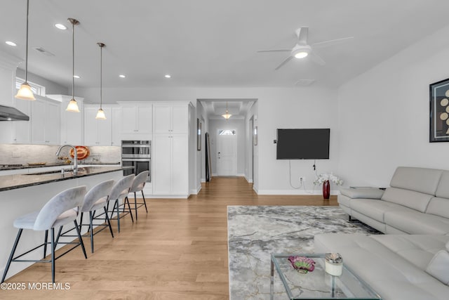 65 Ambermist Way, Forked River, NJ 08731 - living room with light wood-style flooring, a ceiling fan, and recessed lighting