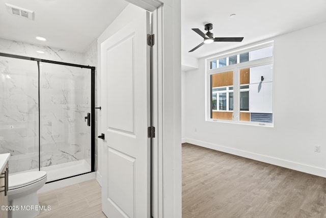 1010 Boulevard Blvd Unit 1E, Seaside Heights, NJ 08751 - bathroom with a marble finish shower, ceiling fan, vanity, and wood finished floors