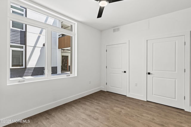 1010 Boulevard Blvd Unit 1E, Seaside Heights, NJ 08751 - unfurnished bedroom featuring light wood finished floors and a ceiling fan