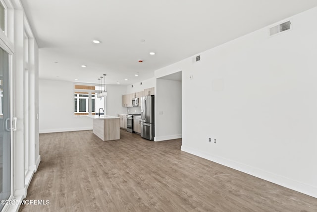 1010 Boulevard Blvd Unit 1E, Seaside Heights, NJ 08751 - unfurnished living room featuring wood finished floors and recessed lighting