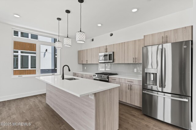 1010 Boulevard Blvd Unit 1E, Seaside Heights, NJ 08751 - kitchen with appliances with stainless steel finishes, light brown cabinetry, a kitchen island with sink, light countertops, and recessed lighting