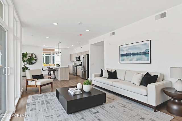 1010 Boulevard Blvd Unit 1E, Seaside Heights, NJ 08751 - living room featuring light wood finished floors and recessed lighting