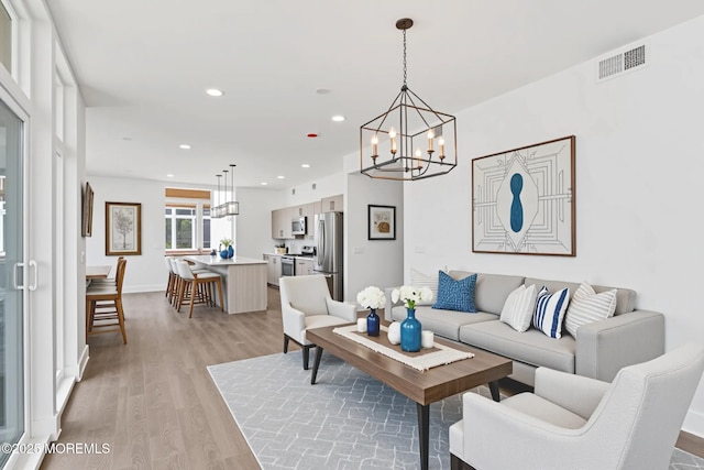 1010 Boulevard Blvd Unit 1E, Seaside Heights, NJ 08751 - living room with a chandelier, light wood-style floors, and recessed lighting