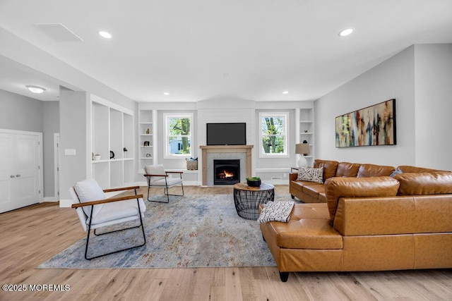 45 Shore Acres Ave, North Middletown, NJ 07748 - living room featuring built in features, wood finished floors, a premium fireplace, and recessed lighting